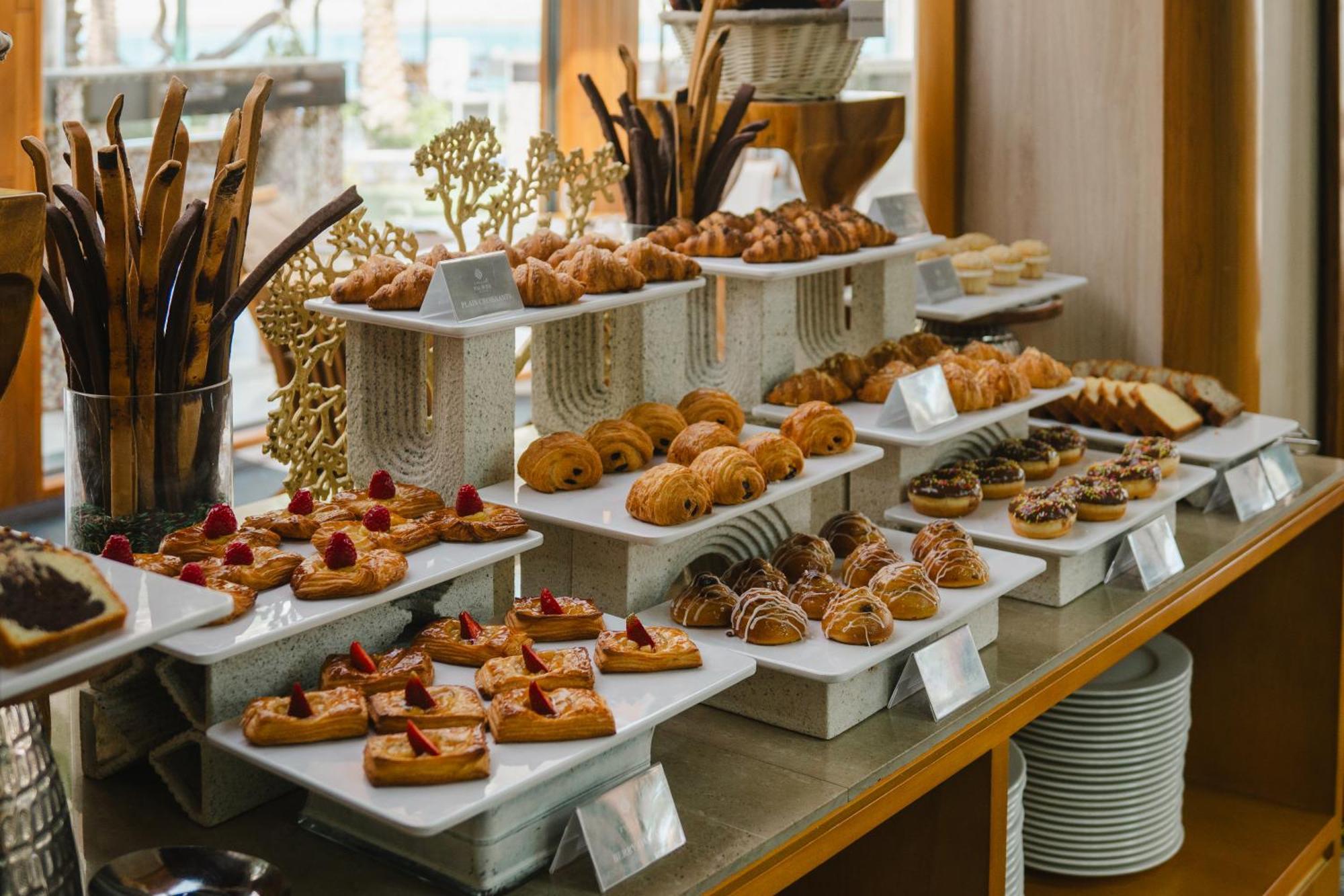 Palavra Resort Manama Exterior photo A selection of pastries