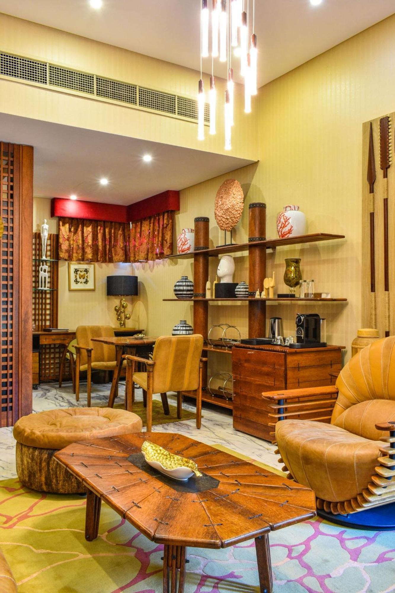 Palavra Resort Manama Exterior photo A living room in a suite at the hotel