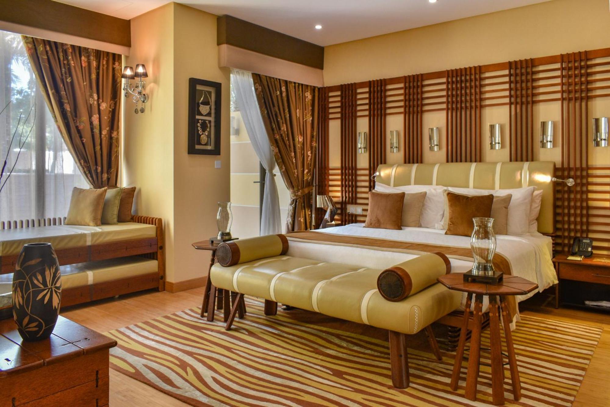 Palavra Resort Manama Exterior photo A bedroom at the Taj Bengal