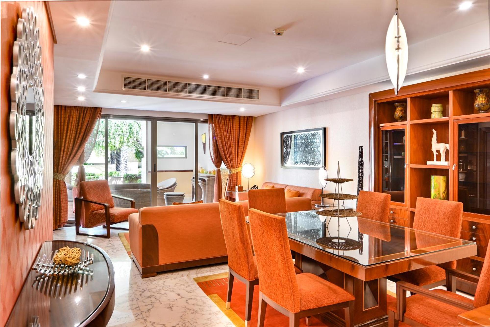 Palavra Resort Manama Exterior photo A living room in a suite at the hotel